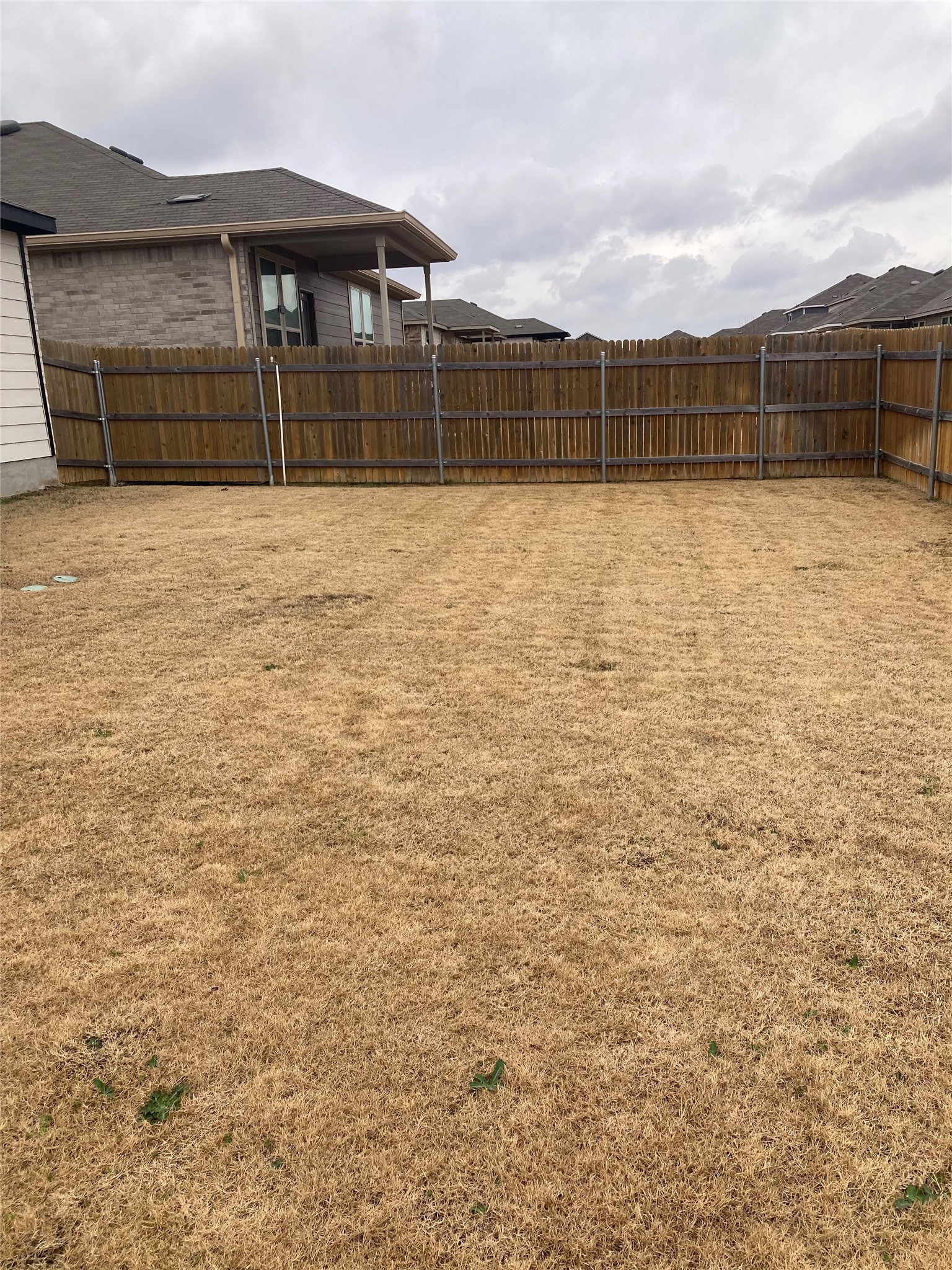 137 Onna Street Taylor, TX 76574 - Photo 13 of 13 Fenced yard