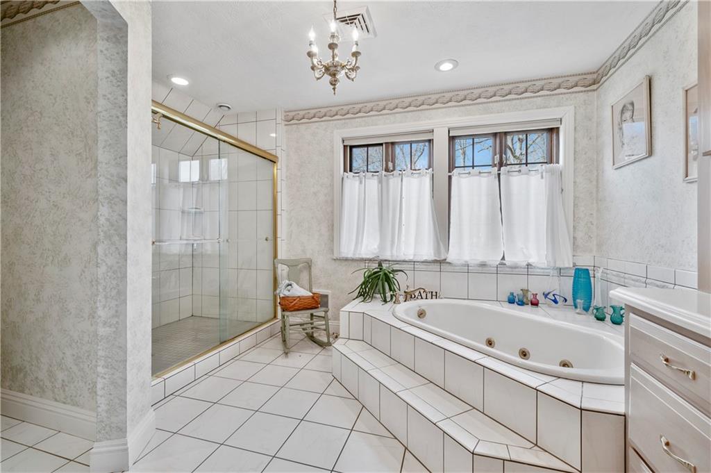 620 North Franklin Avenue Somerset, PA 15501 - Photo 22 of 37 a spacious bathroom with a tub sink and mirror