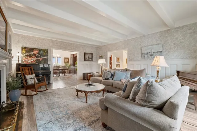 a living room with furniture and a table