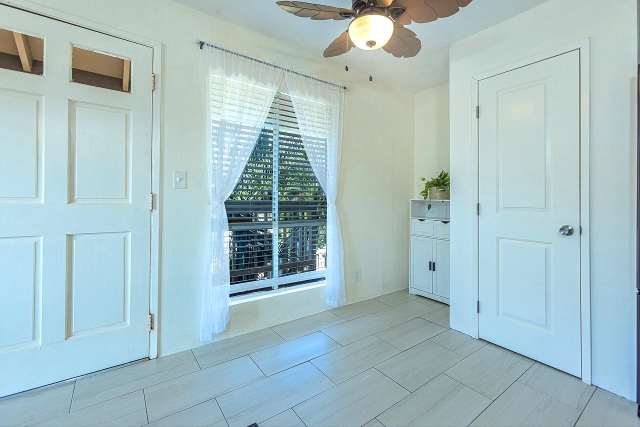 140 Uwapo Road, Unit 55205 Kihei, HI 96753 - Photo 12 of 31 a view of an empty room with a window