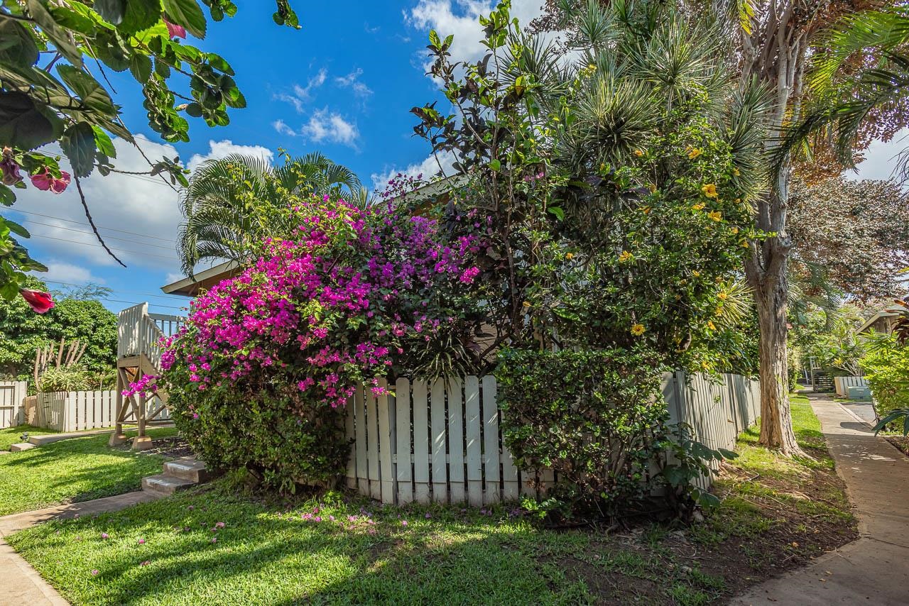 140 Uwapo Road, Unit 55205 Kihei, HI 96753 - Photo 24 of 31 a view of a house with a yard and garden