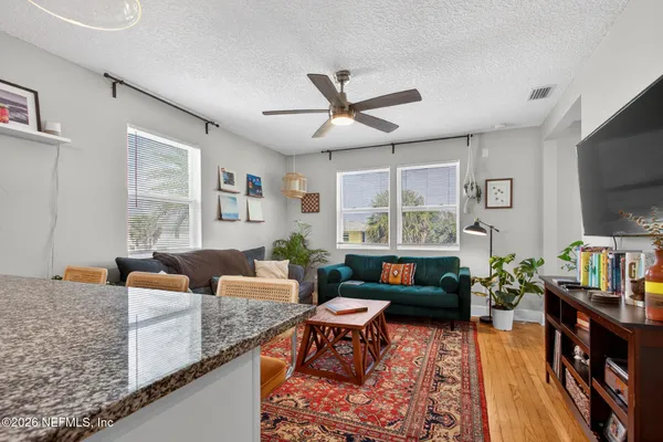 an aerial view of residential houses with outdoor space