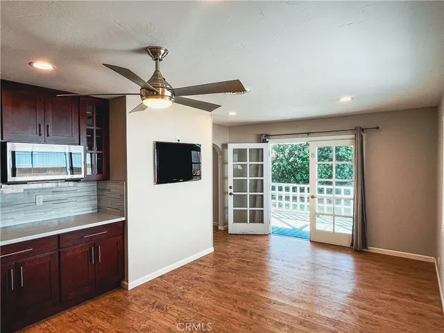 a view of a kitchen with a sink and a window