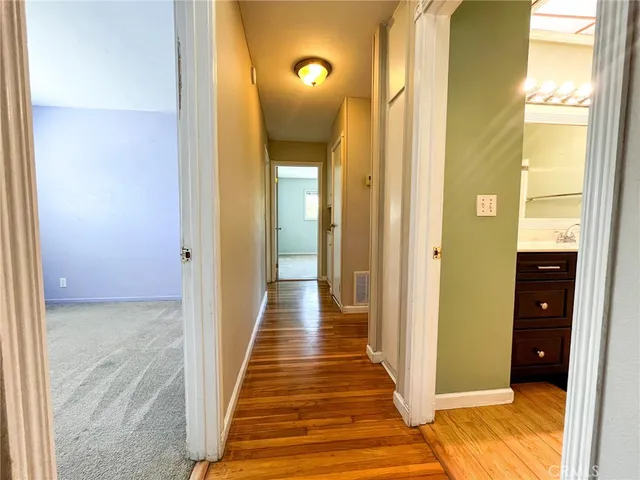 a view of a bathroom from the hallway