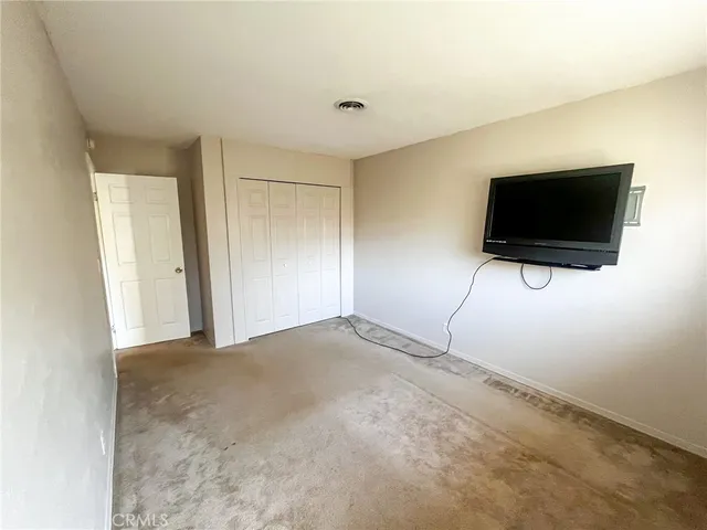 a view of a livingroom with a flat screen tv