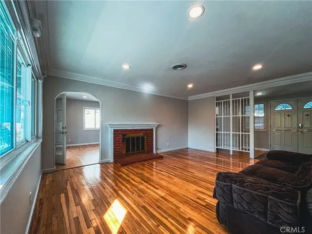 a bedroom with furniture and a fireplace