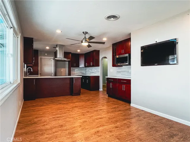 a view of kitchen with a sink and a refrigerator