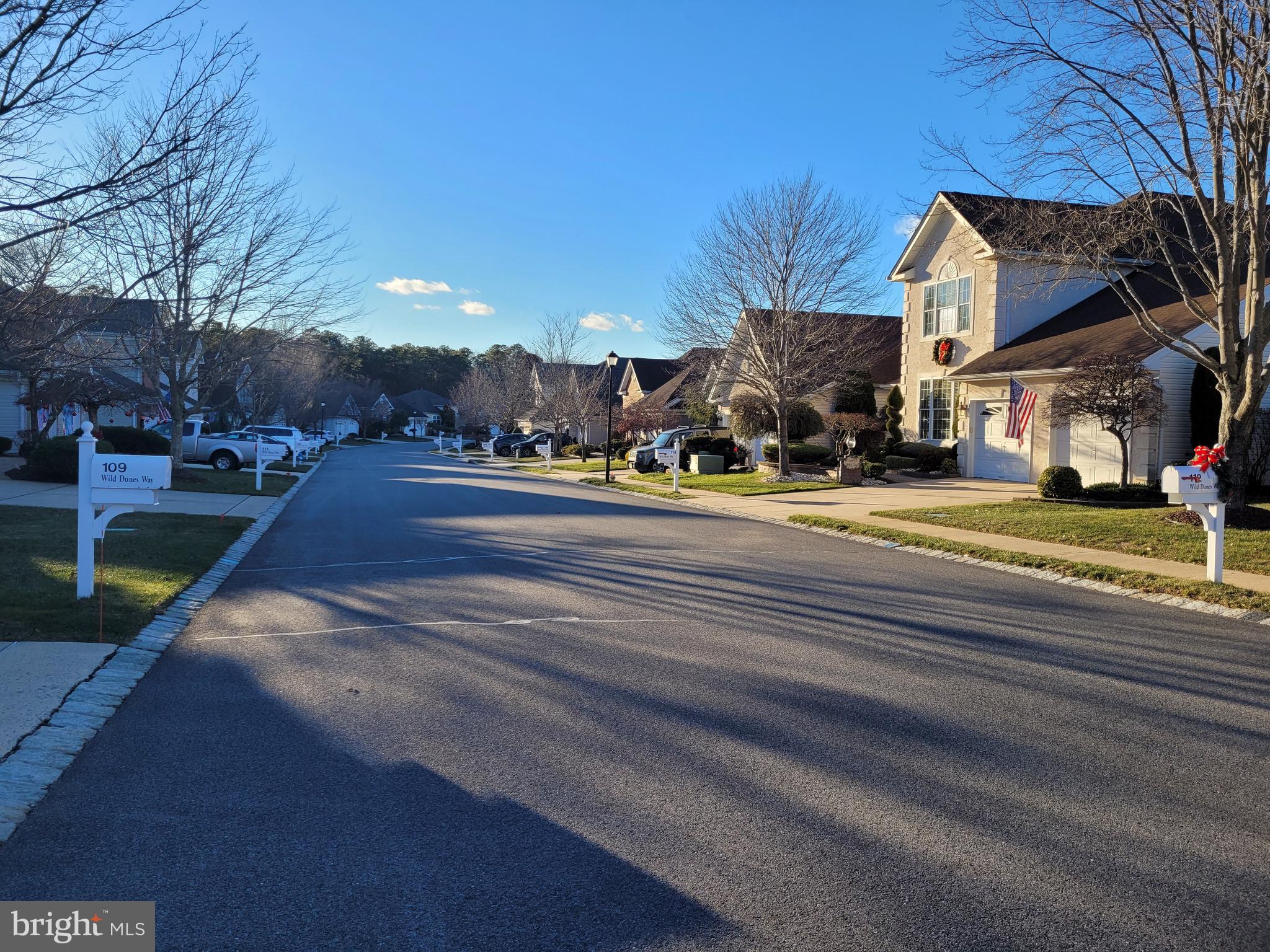 110 Wild Dunes Way Jackson, NJ 08527 - Photo 13 of 82 a view of a building with a yard