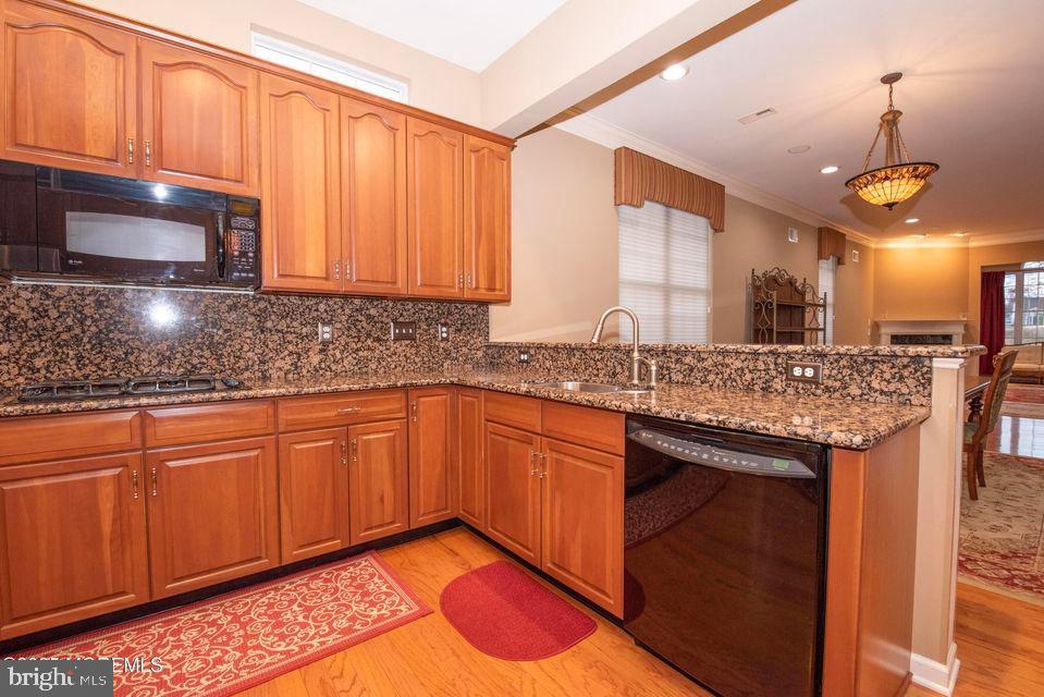 110 Wild Dunes Way Jackson, NJ 08527 - Photo 36 of 82 a kitchen with stainless steel appliances granite countertop wooden cabinets a sink and dishwasher