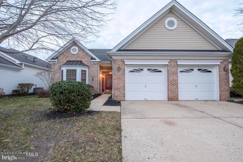 110 Wild Dunes Way Jackson, NJ 08527 - Photo 79 of 82 a front view of a house with a yard and garage