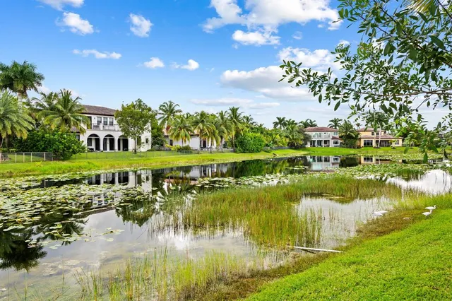 a view of a lake with a house in the background