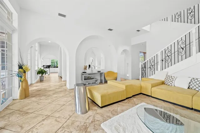 a living room with furniture and a table