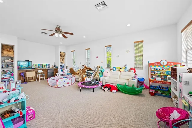 a play room with toys and a couch