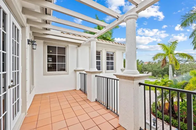a view of a porch with wooden floor and fence