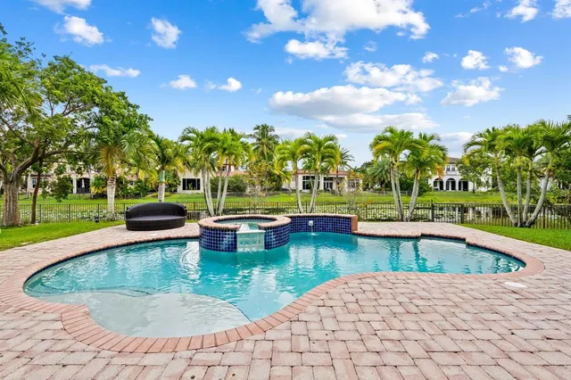 a view of a swimming pool with a patio