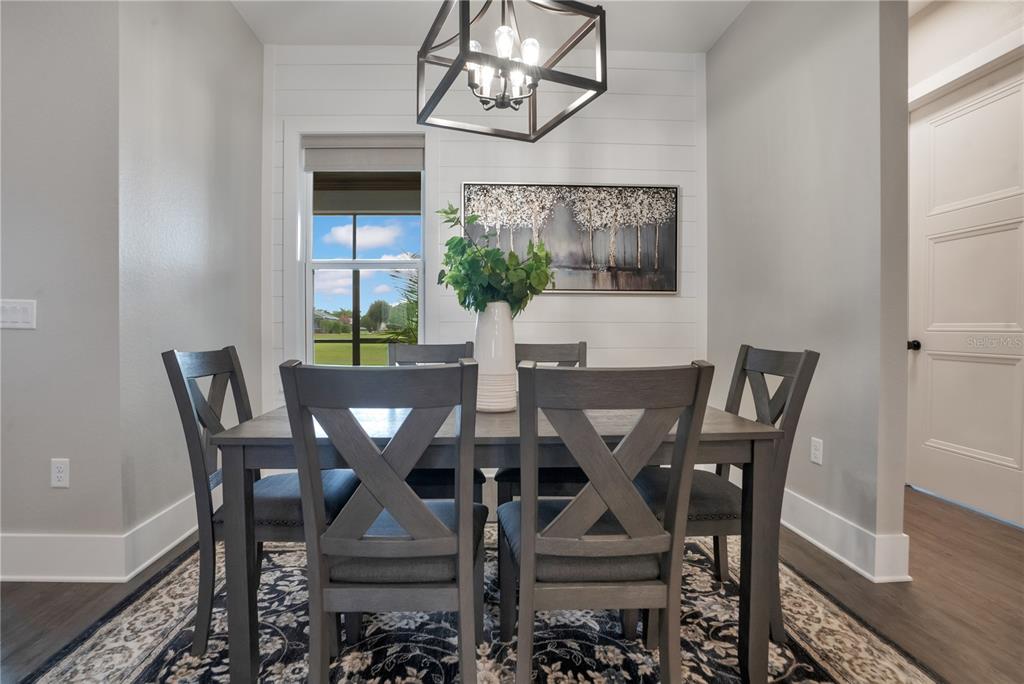 440 Palma Ceia Road Winter Haven, FL 33884 - Photo 19 of 78 a view of a dining room with furniture and wooden floor