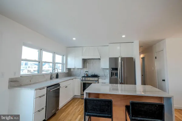a kitchen with a sink and a window