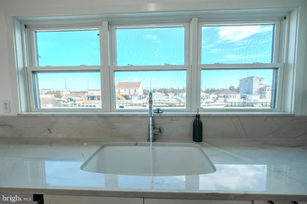 a stove top oven sitting inside of a kitchen