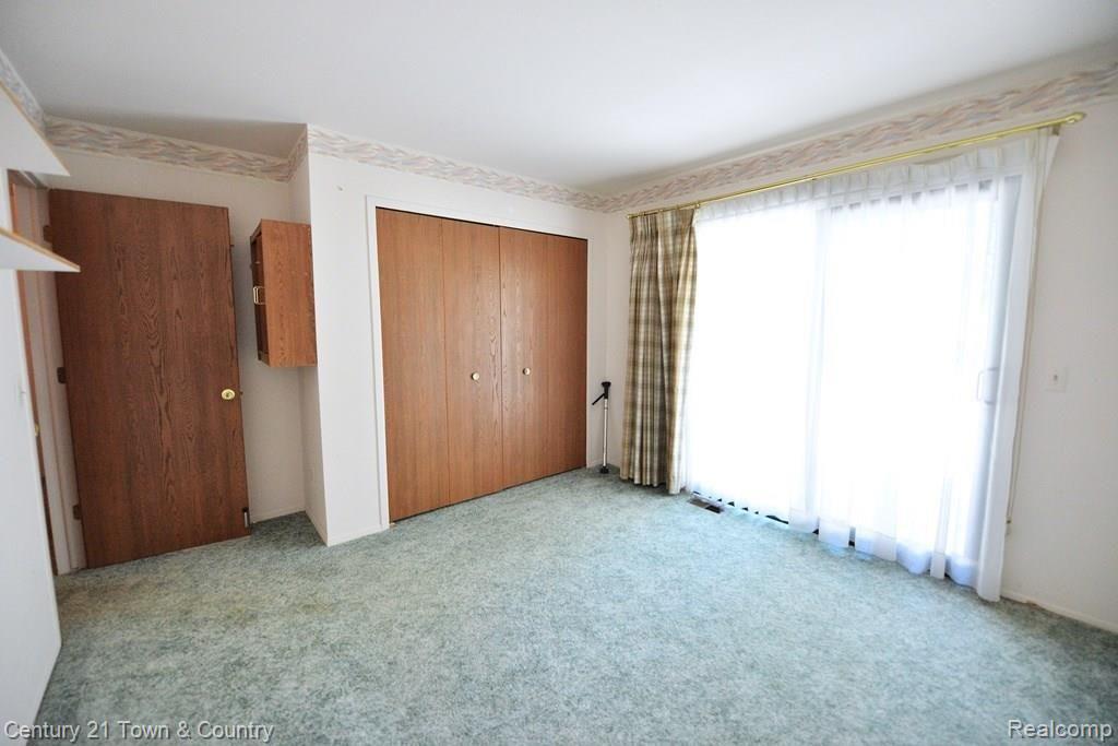 683 Tennyson, Unit 31 Rochester, MI 48307 - Photo 20 of 48 Second bedroom with door wall to deck.
