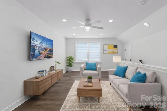 a living room with furniture and a rug