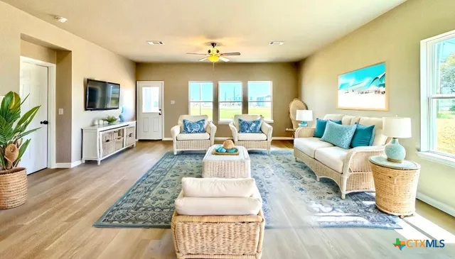 a living room with furniture and a flat screen tv