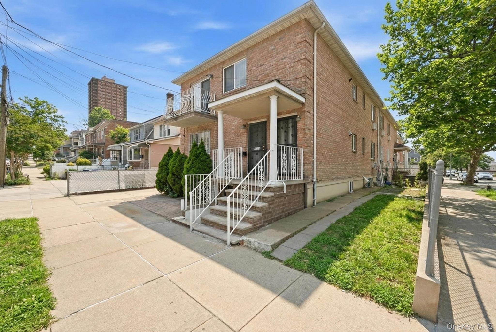 61-16 161 Street Queens, NY 11365 - Photo 2 of 22 a front view of a house with garden