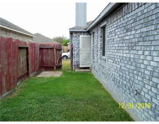 a view of a backyard with potted plants