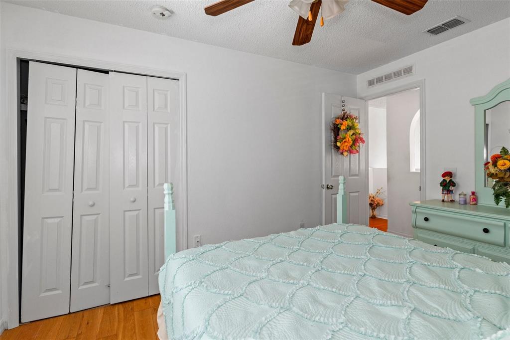 10331 Dunkirk Road Spring Hill, FL 34608 - Photo 30 of 42 a bedroom with a bed and a window