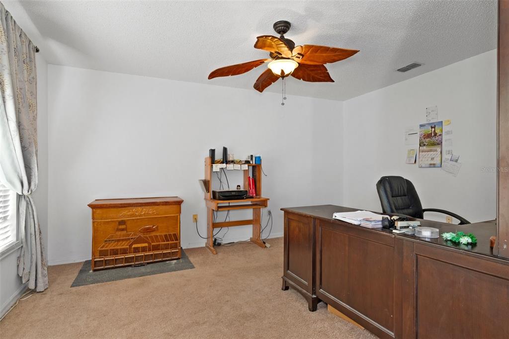 10331 Dunkirk Road Spring Hill, FL 34608 - Photo 9 of 42 a view of room with a window and a ceiling fan