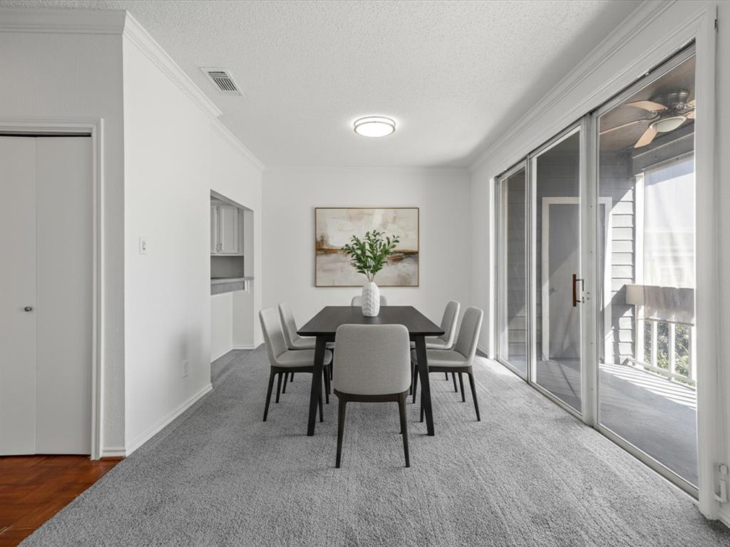 5310 Keller Springs Road, Unit 332 Dallas, TX 75248 - Photo 5 of 39 Dining area featuring crown molding, a textured ceiling, ceiling fan, and carpet floors