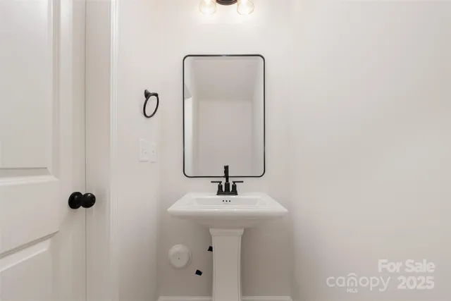 a bathroom with a sink and mirror