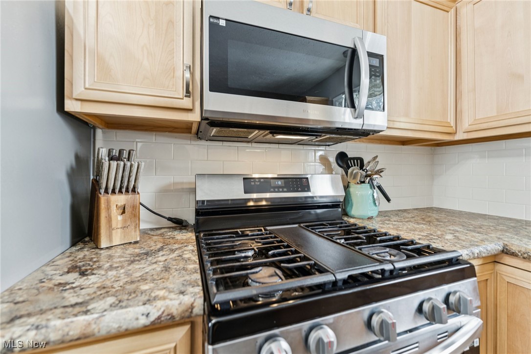 15608 Mason Road Vermilion, OH 44089 - Photo 10 of 34 Gas stove and microwave.