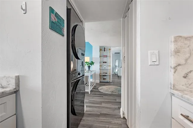 a view of a livingroom with furniture and stairs