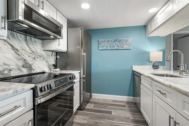 a kitchen with a stove and a sink