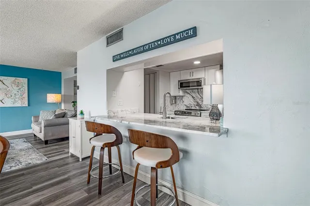 a dining room with table and chairs