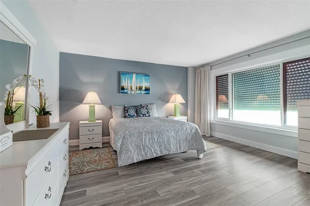 a bedroom with bed and window