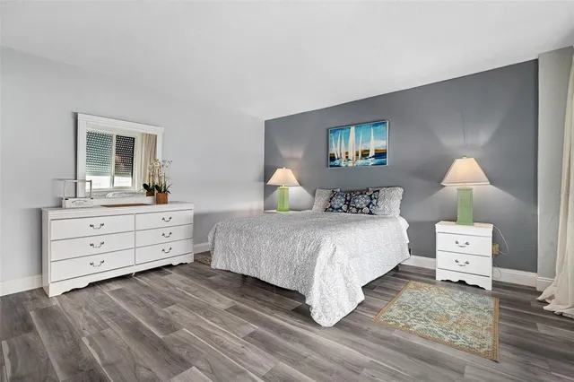 a bedroom with a bed and a dresser