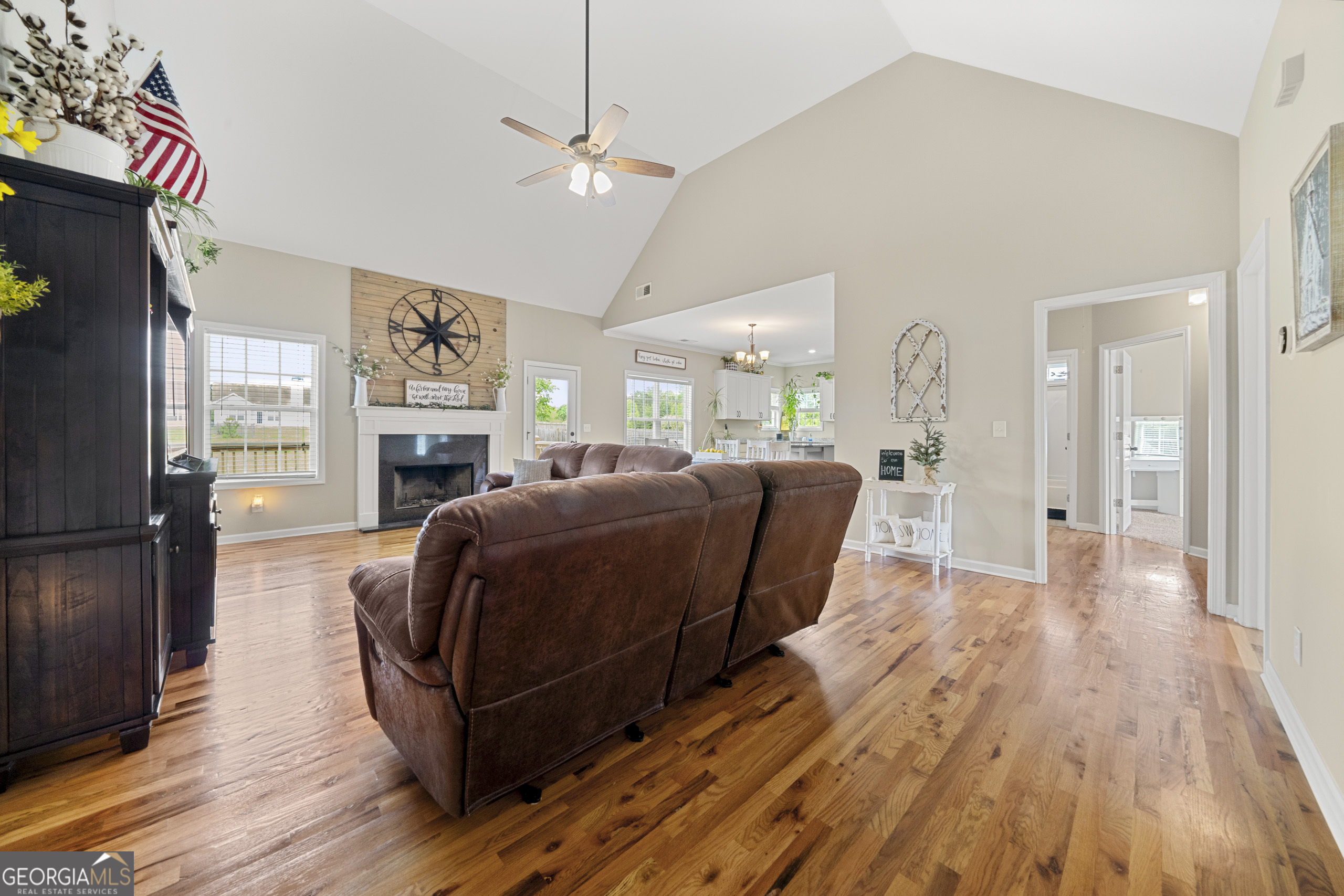 304 Kodiak Road Carrollton, GA 30117 - Photo 13 of 36 a living room with furniture wooden floor and a fireplace