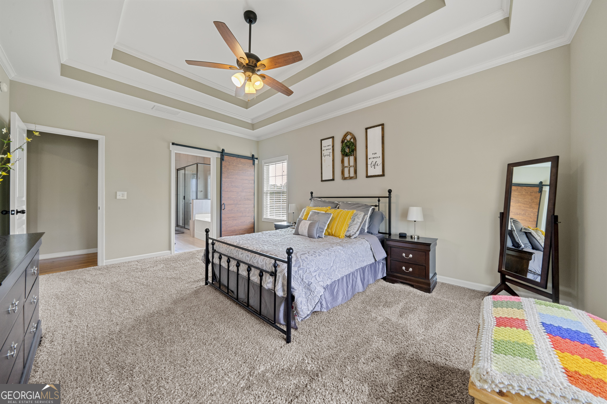 304 Kodiak Road Carrollton, GA 30117 - Photo 20 of 36 a bed room with a bed and a chandelier