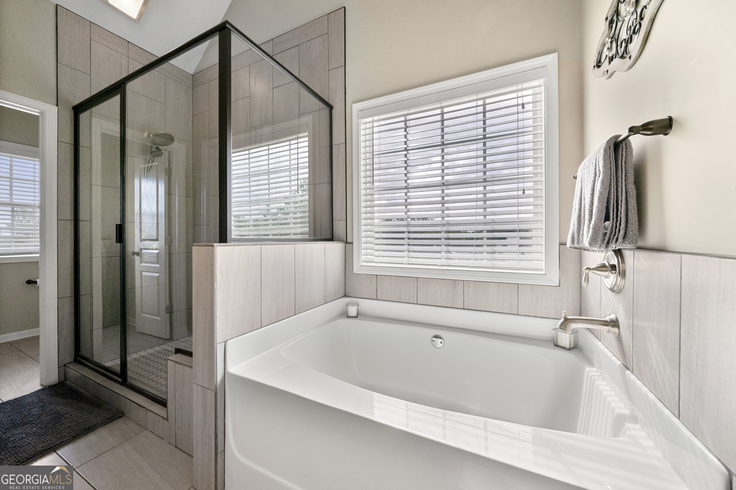 304 Kodiak Road Carrollton, GA 30117 - Photo 23 of 36 a bathroom with a bathtub and a shower
