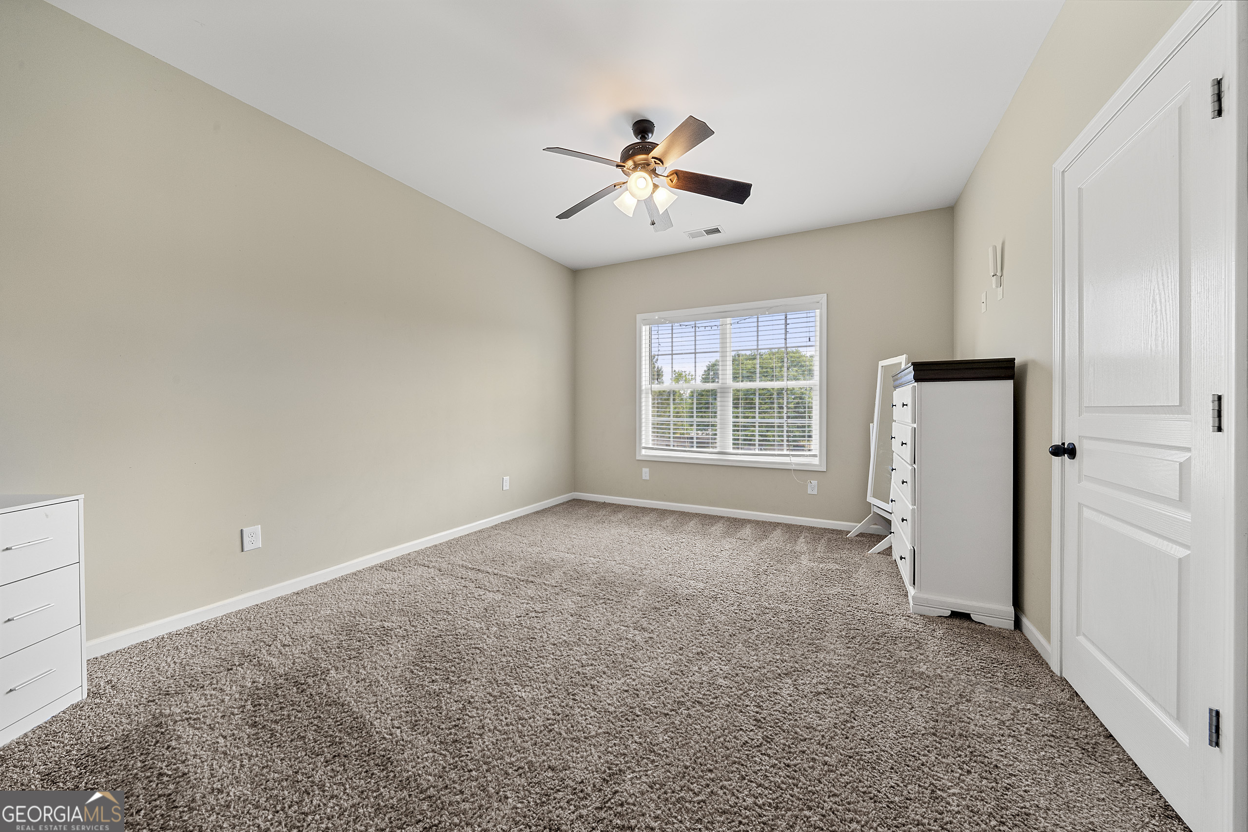 304 Kodiak Road Carrollton, GA 30117 - Photo 26 of 36 an empty room with windows and fan