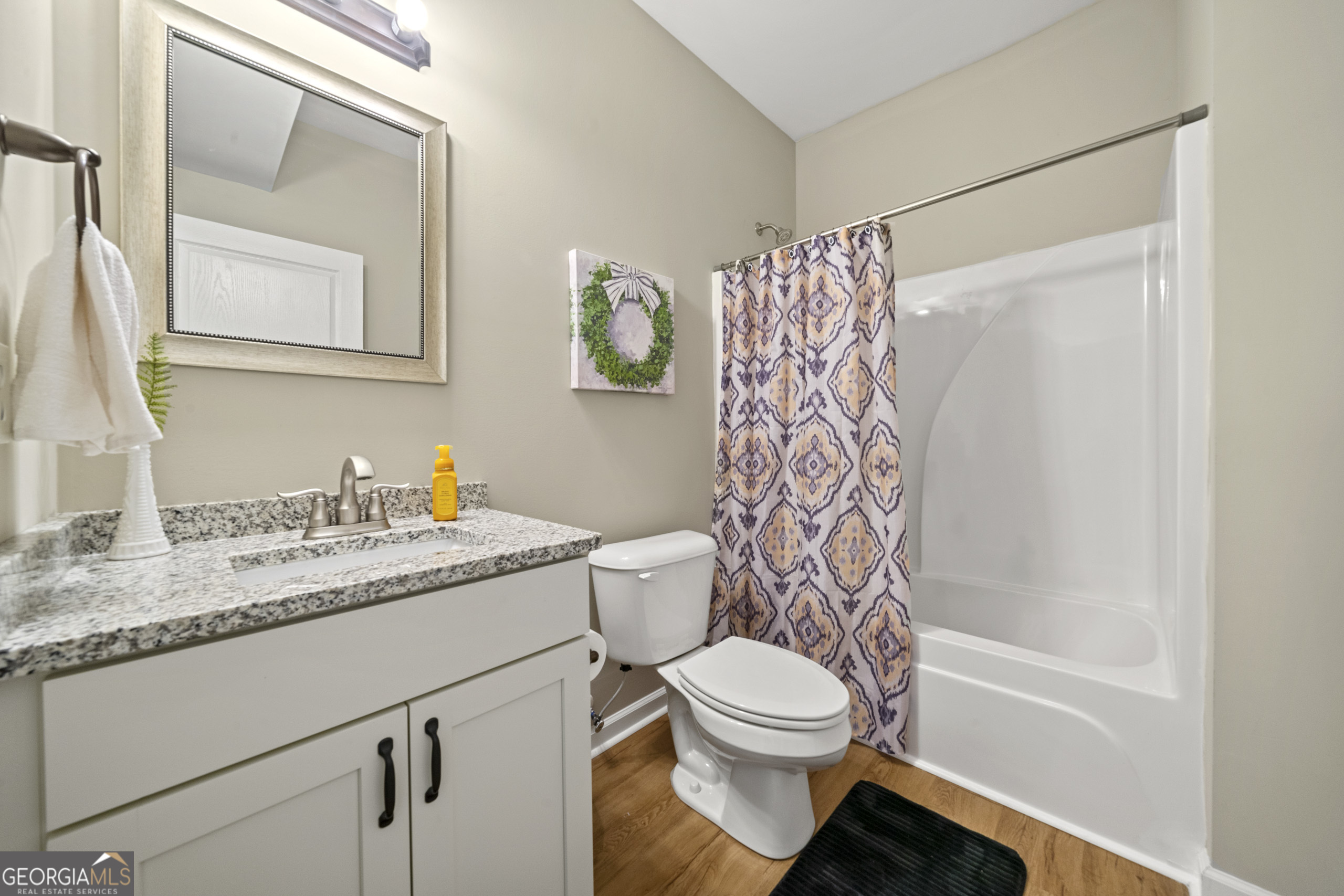 304 Kodiak Road Carrollton, GA 30117 - Photo 27 of 36 a bathroom with a granite countertop sink toilet and shower