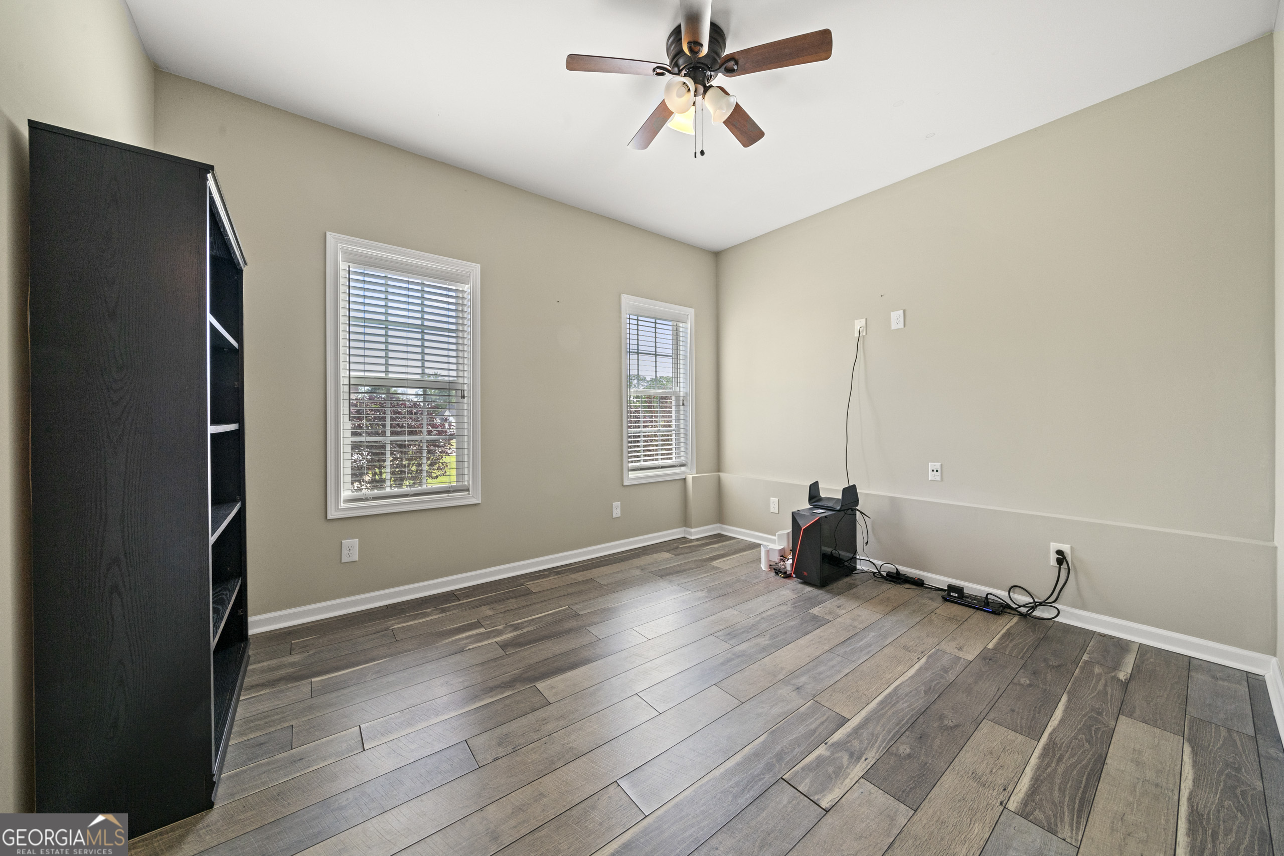 304 Kodiak Road Carrollton, GA 30117 - Photo 35 of 36 a view of an empty room with wooden floor and a window