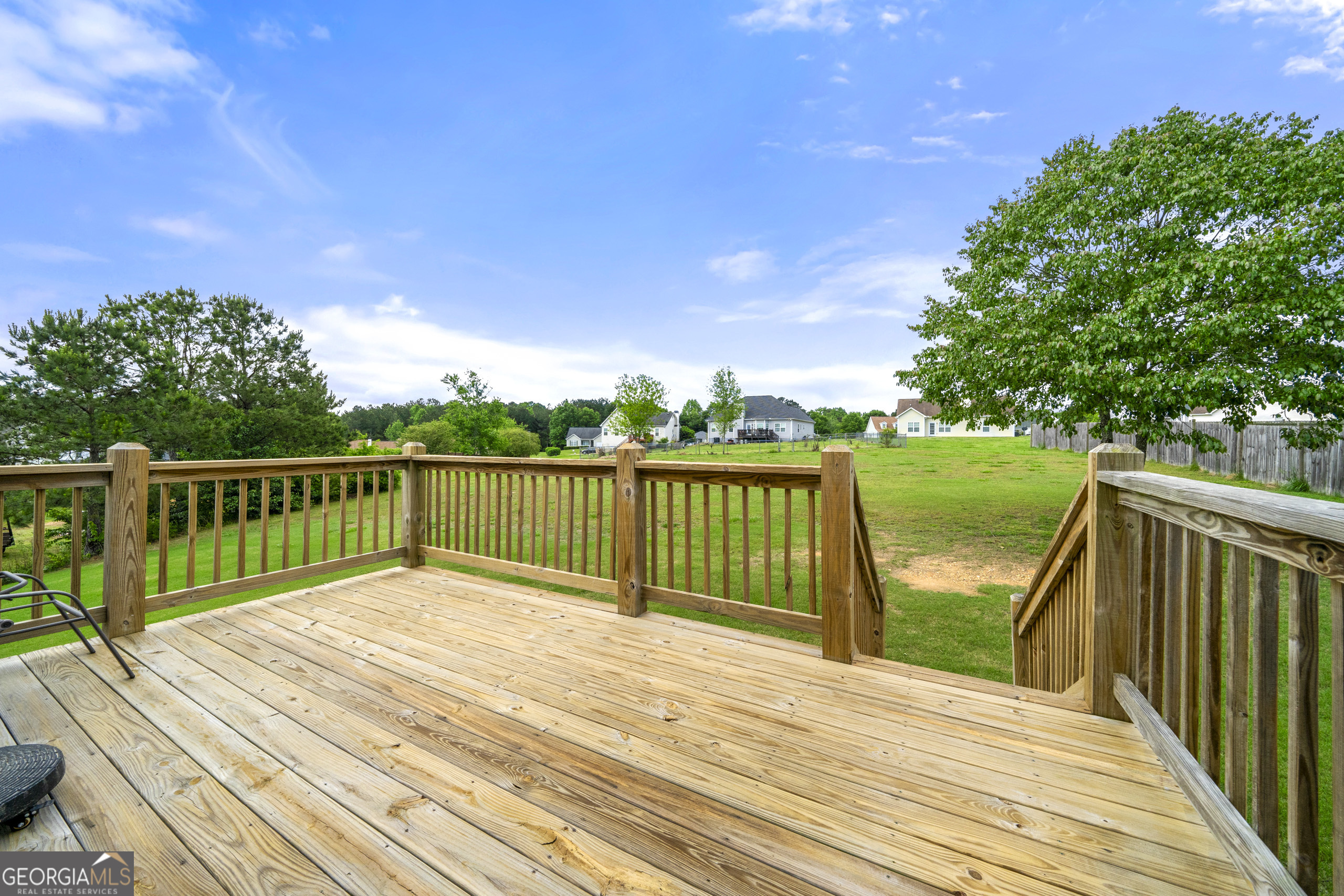 304 Kodiak Road Carrollton, GA 30117 - Photo 8 of 36 a view of balcony with wooden floor and fence