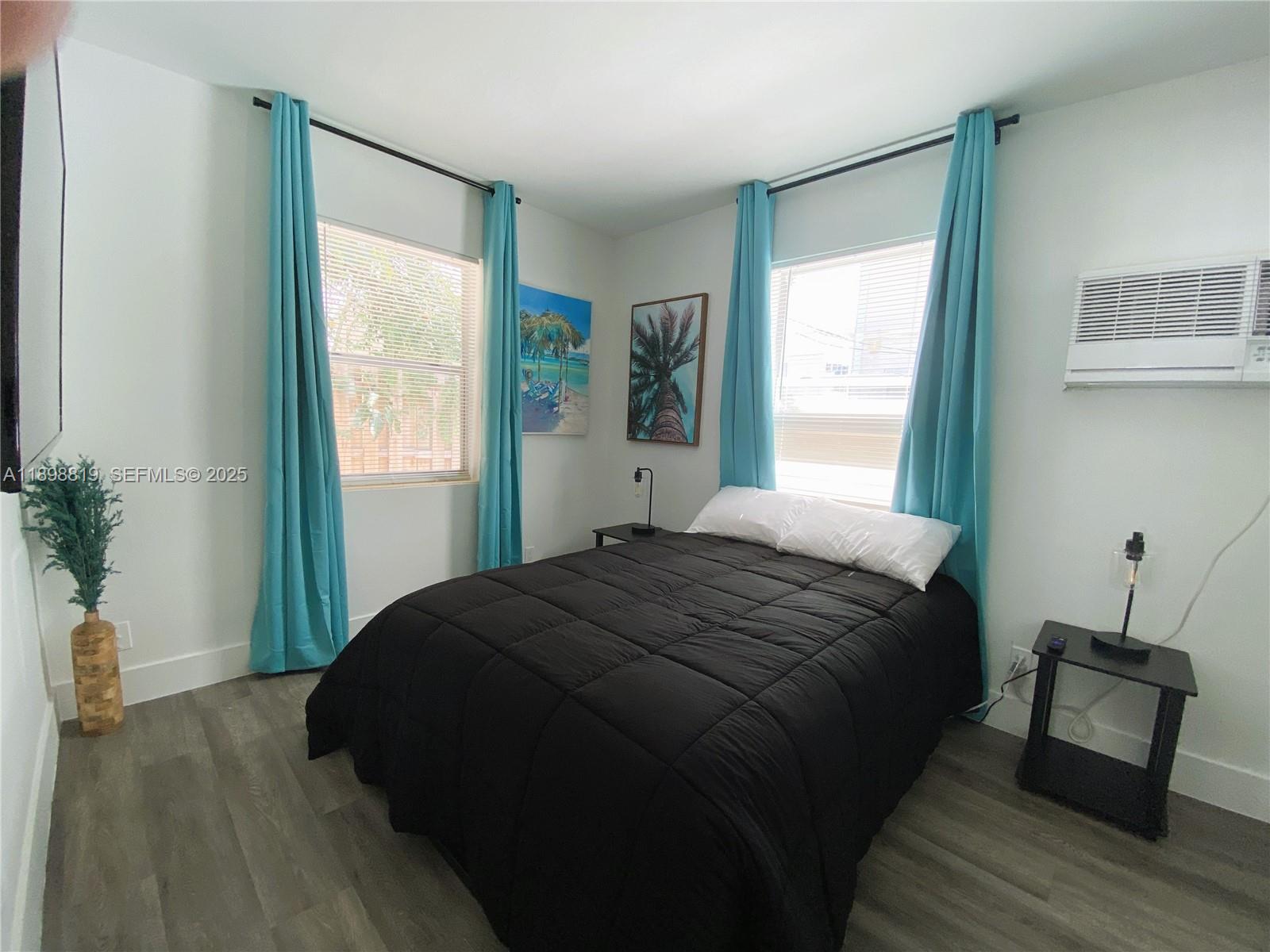 3208 Canal Drive, Unit 4 Pompano Beach, FL 33062 - Photo 11 of 15 a bedroom with a bed and a window
