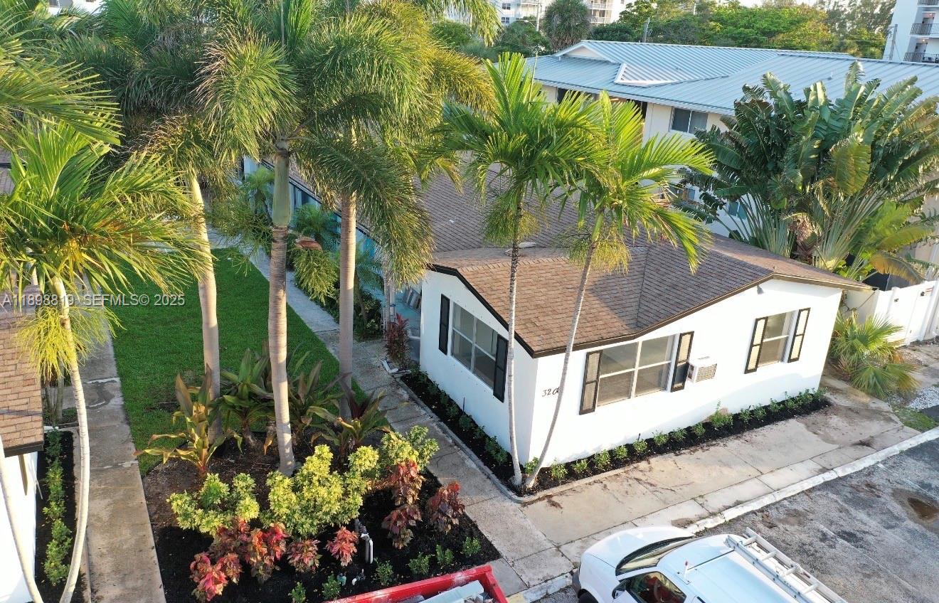 3208 Canal Drive, Unit 4 Pompano Beach, FL 33062 - Photo 3 of 15 a house view with a garden space