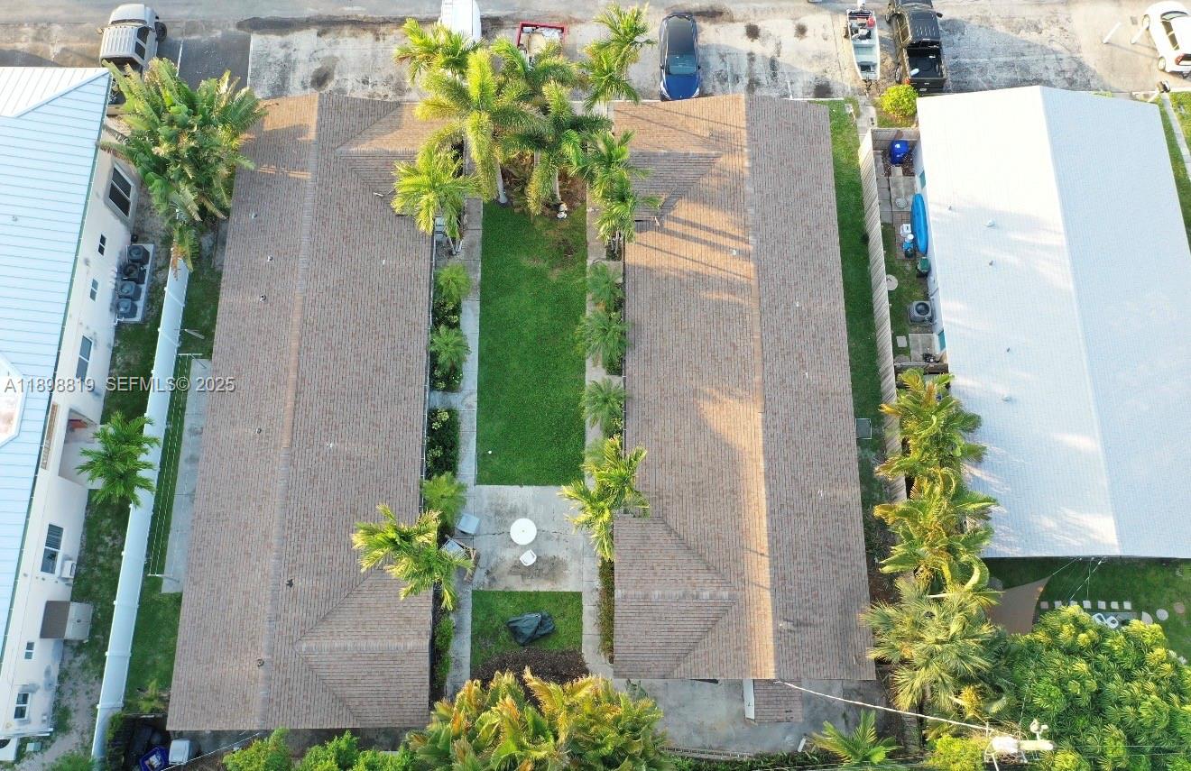 3208 Canal Drive, Unit 4 Pompano Beach, FL 33062 - Photo 5 of 15 an aerial view of a house with a yard and chandelier