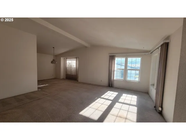 a room with a bed and a window