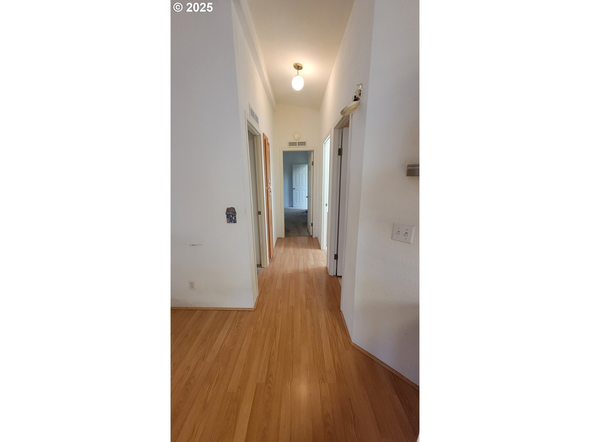 193 Clark Street Myrtle Creek, OR 97457 - Photo 23 of 31 a view of a hallway with wooden floor