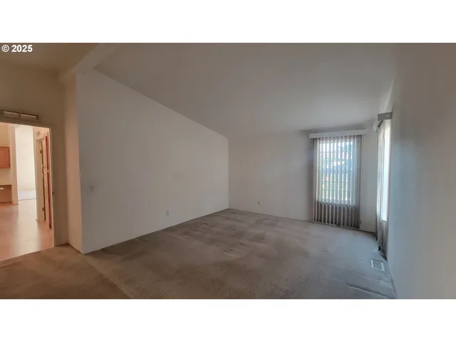 a black and white photo of a living room